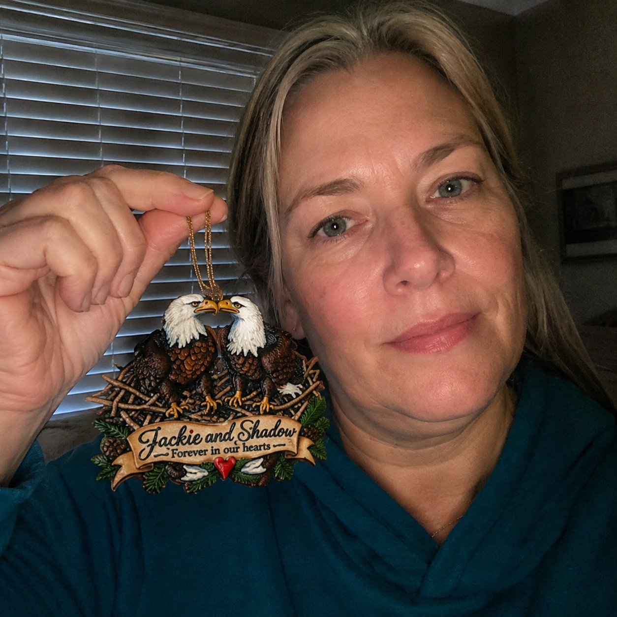Customer holding Jackie and Shadow ornament